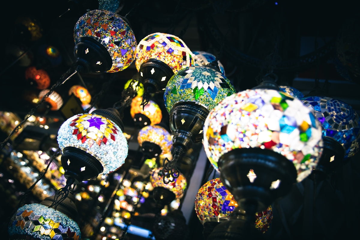 a bunch of colorful lights hanging from a ceiling