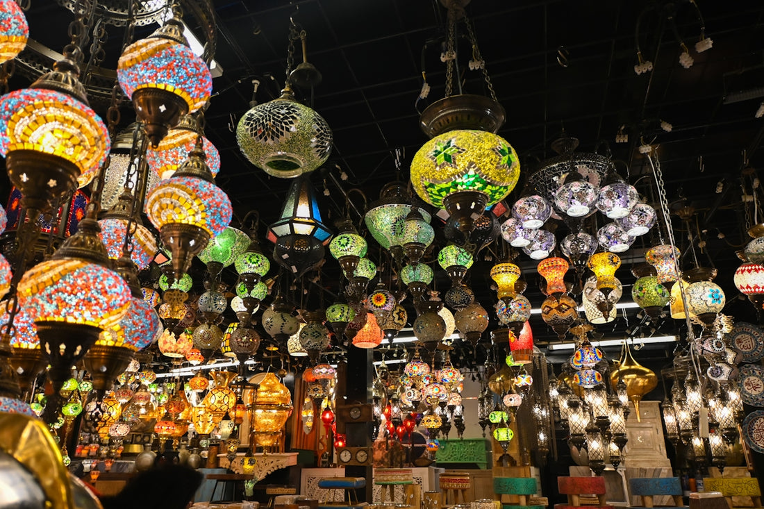 Many colorful lamps hang from the ceiling.
